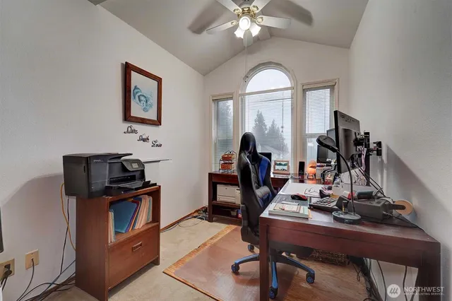 a bed room with a bed and a television