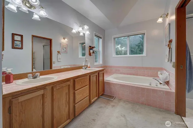 a white toilet sitting next to a shower