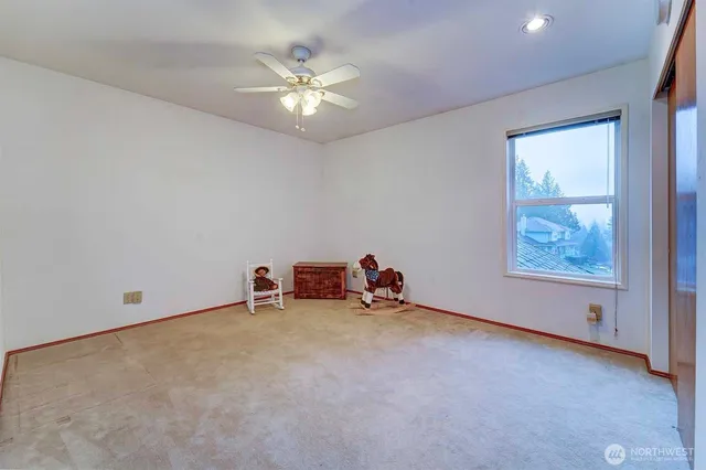 an empty room with closet area