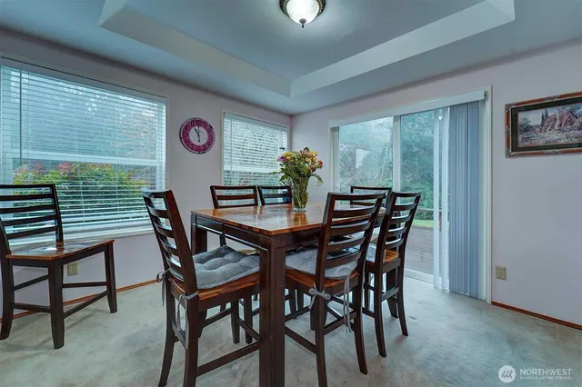 a view of a dining room with furniture and window