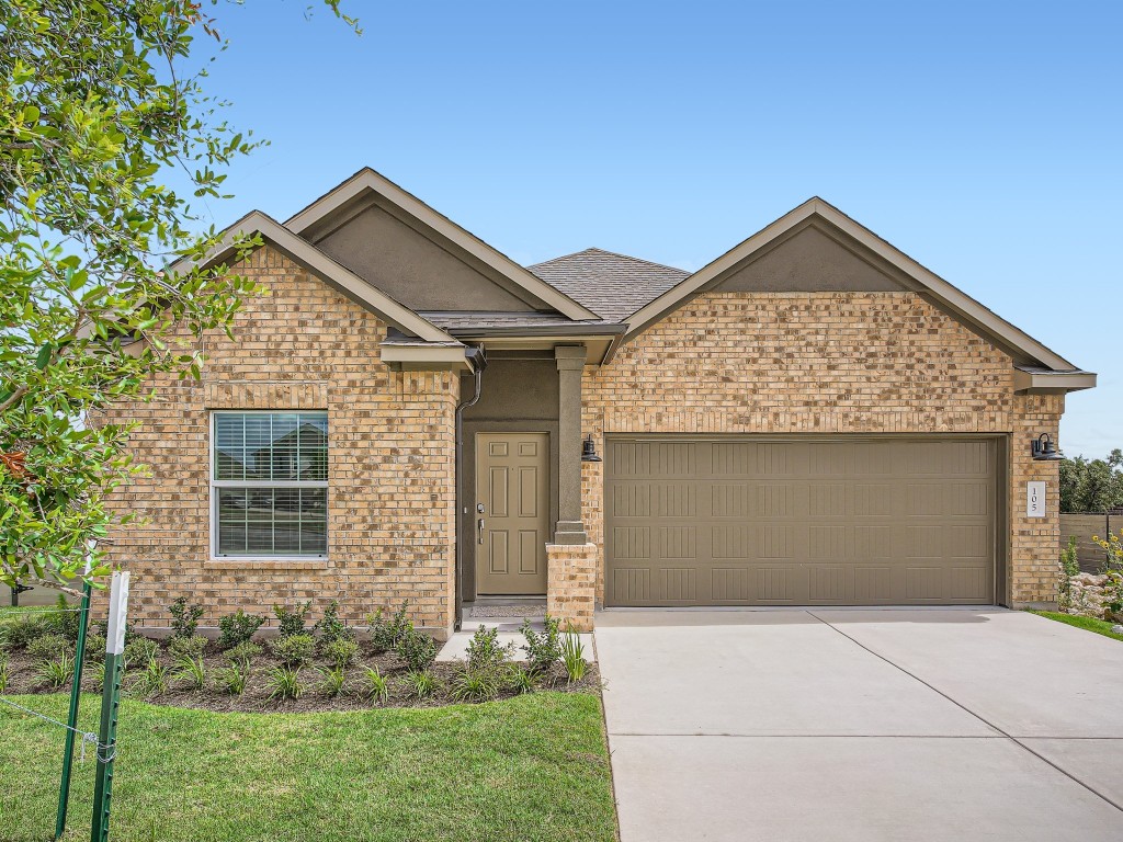 105 Starflower Cove Georgetown, TX 78628 - Photo 1 of 1 a front view of a house with garden