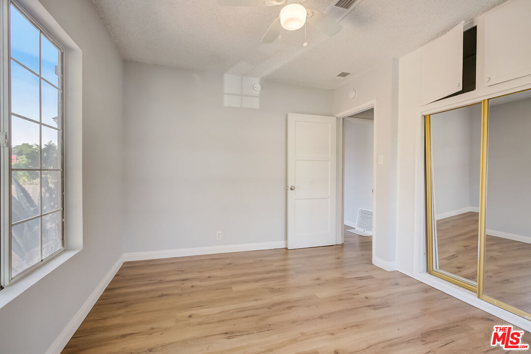 2019 Broach Avenue Duarte, CA 91010 - Photo 27 of 35 a view of an empty room with wooden floor and a window