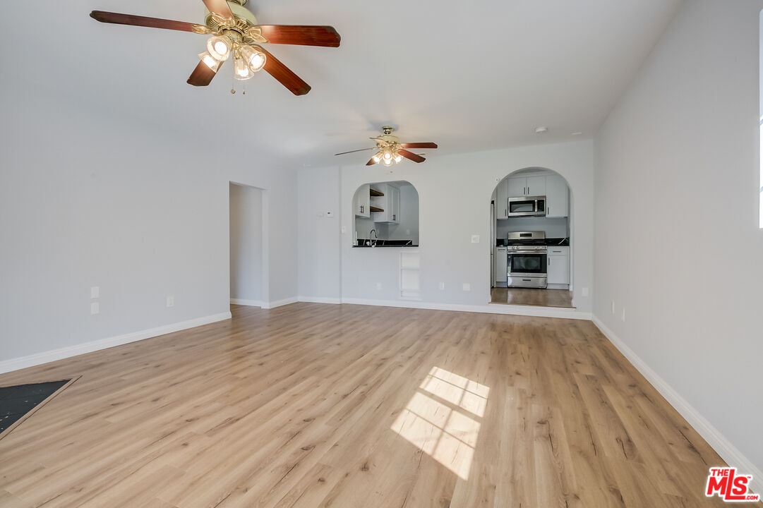 2019 Broach Avenue Duarte, CA 91010 - Photo 8 of 35 a view of empty room with wooden floor and ceiling fan