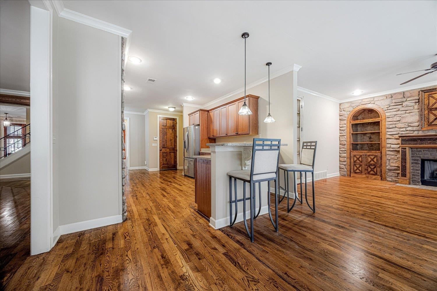 4597 Whisper Spring Drive Collierville, TN 38017 - Photo 10 of 39 an open kitchen with wooden floor and windows