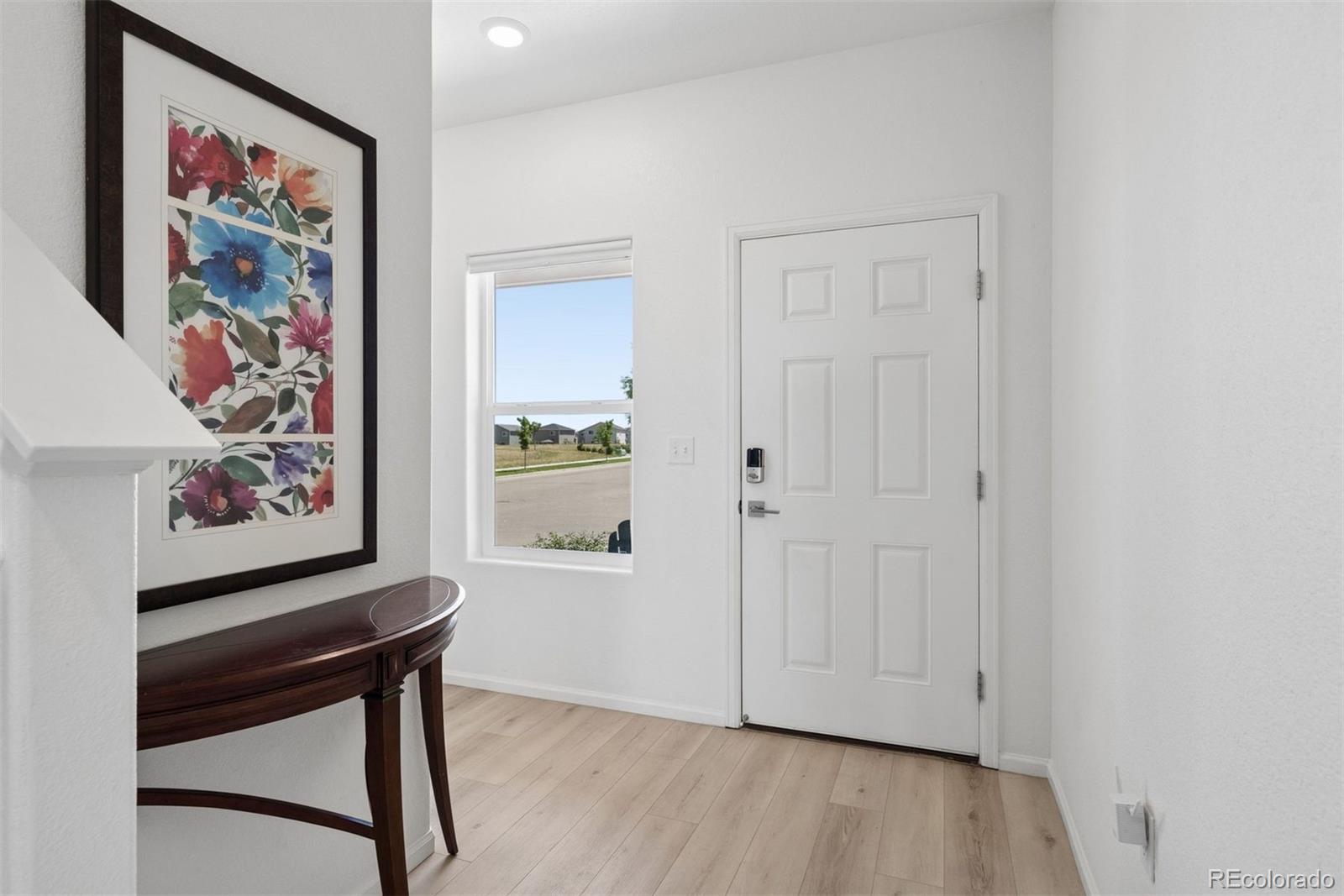 7307 Animas Avenue Frederick, CO 80530 - Photo 10 of 49 a view of an entryway with painting on the wall