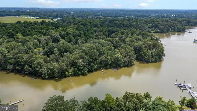 an aerial view of valley and lake