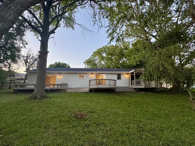 a house with a tree in front of it