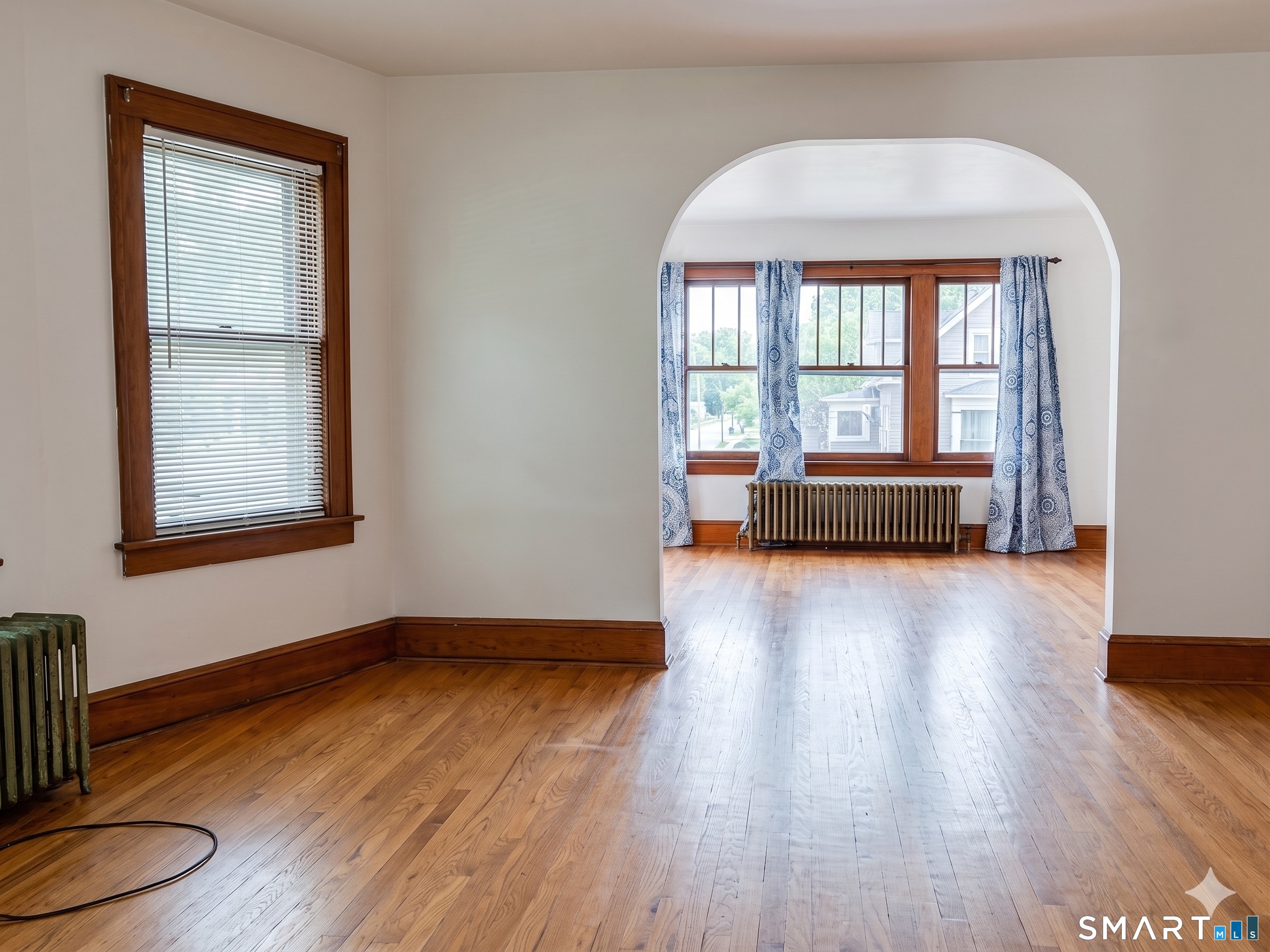 44 Bird Street Torrington, CT 06790 - Photo 11 of 17 an empty room with wooden floor and windows