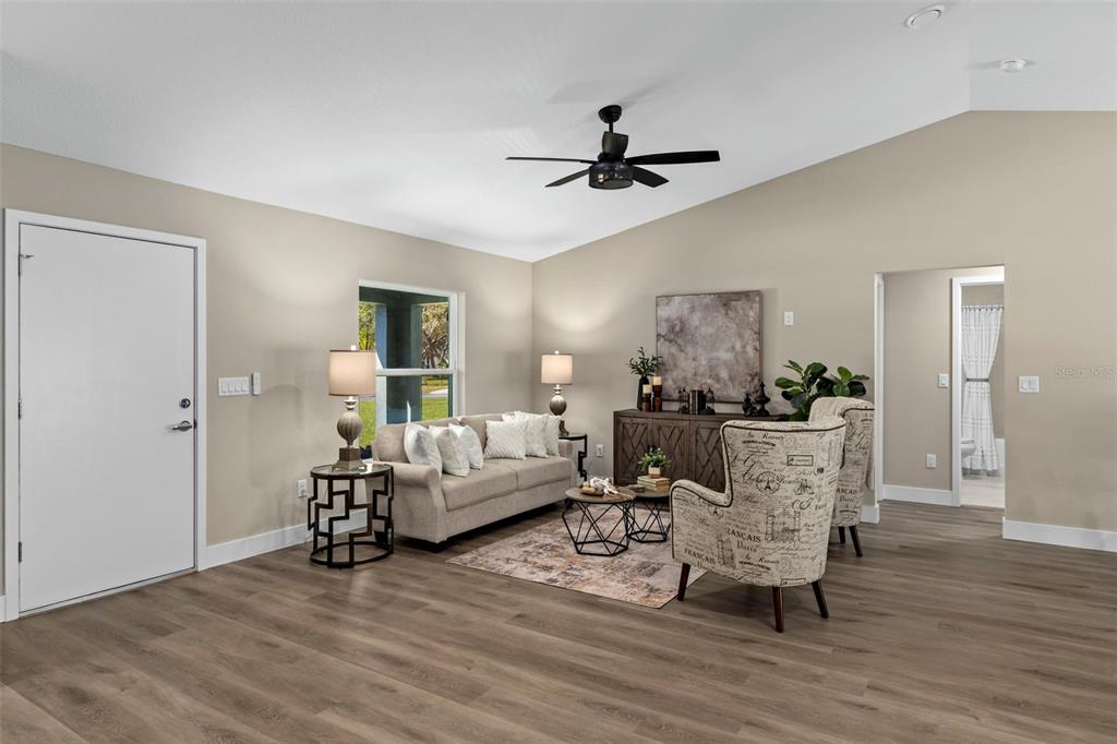 3011 East Griffin Street Inverness, FL 34453 - Photo 14 of 45 a living room with furniture and a wooden floor