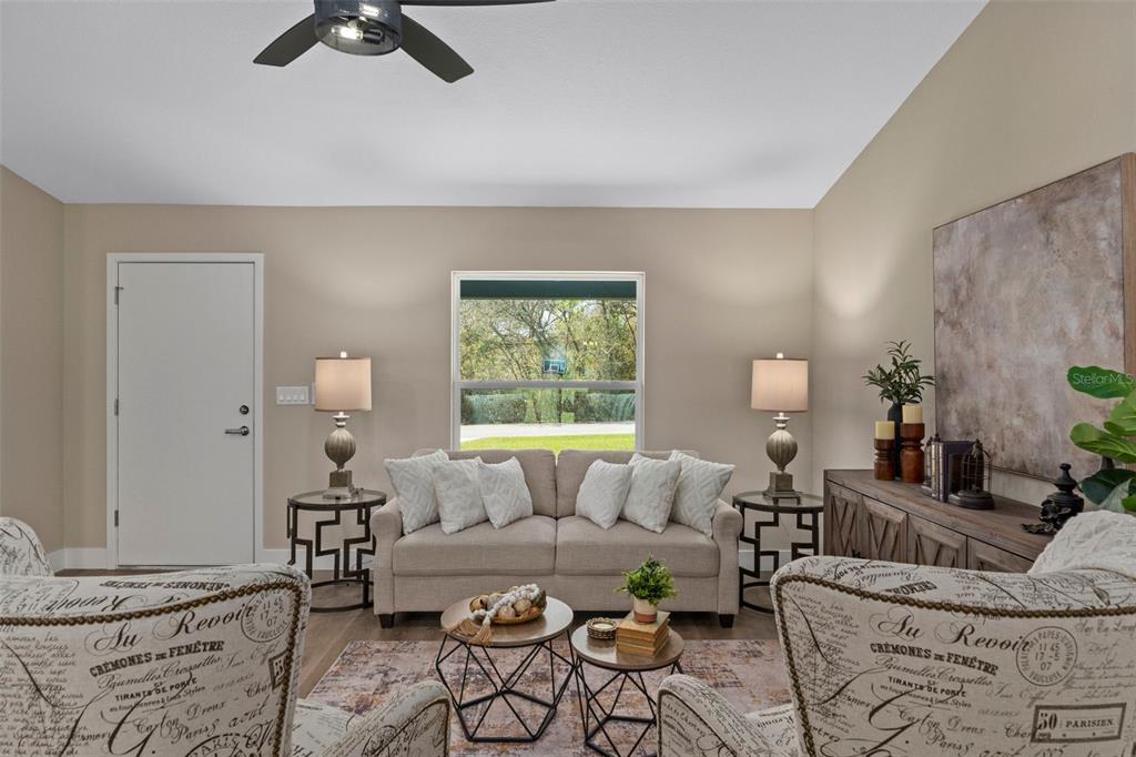 3011 East Griffin Street Inverness, FL 34453 - Photo 16 of 45 a living room with furniture and a large window