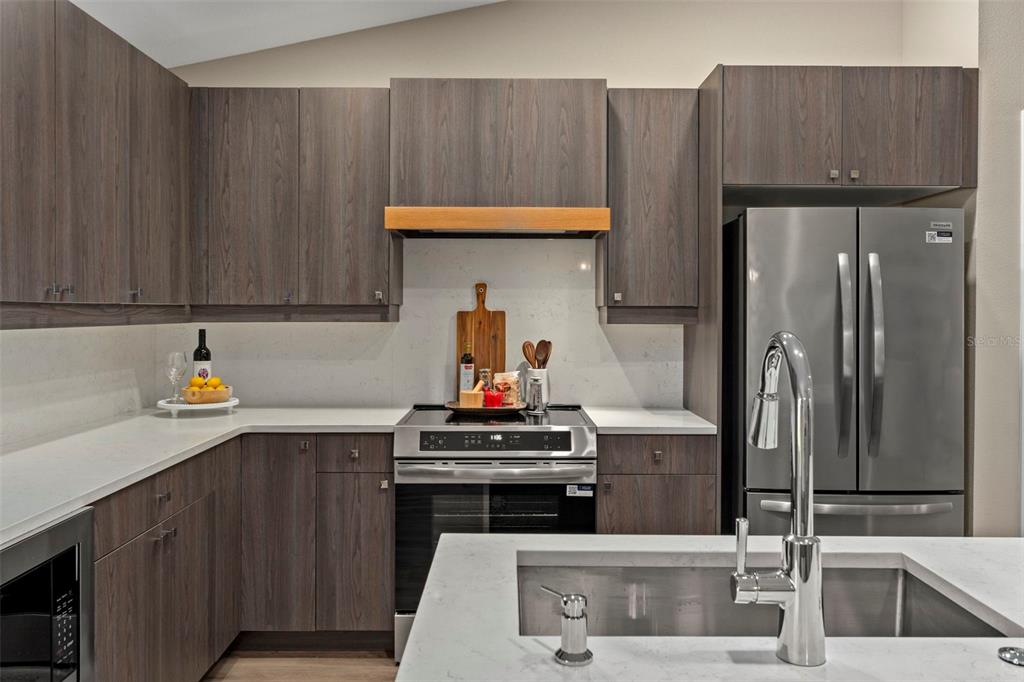 3011 East Griffin Street Inverness, FL 34453 - Photo 21 of 45 a kitchen with a sink and a refrigerator