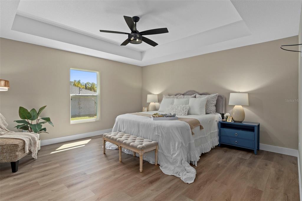 3011 East Griffin Street Inverness, FL 34453 - Photo 24 of 45 a bedroom with a bed chandelier and a window