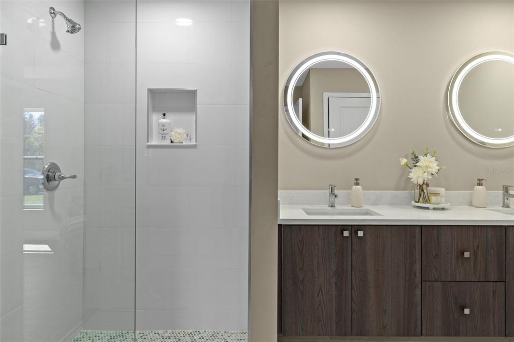 3011 East Griffin Street Inverness, FL 34453 - Photo 29 of 45 a bathroom with a granite countertop toilet a sink and a mirror