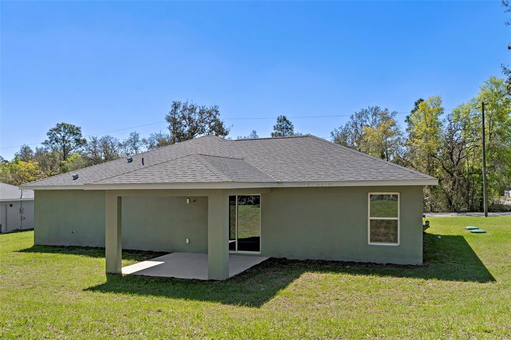3011 East Griffin Street Inverness, FL 34453 - Photo 3 of 45 a front view of a house with a yard