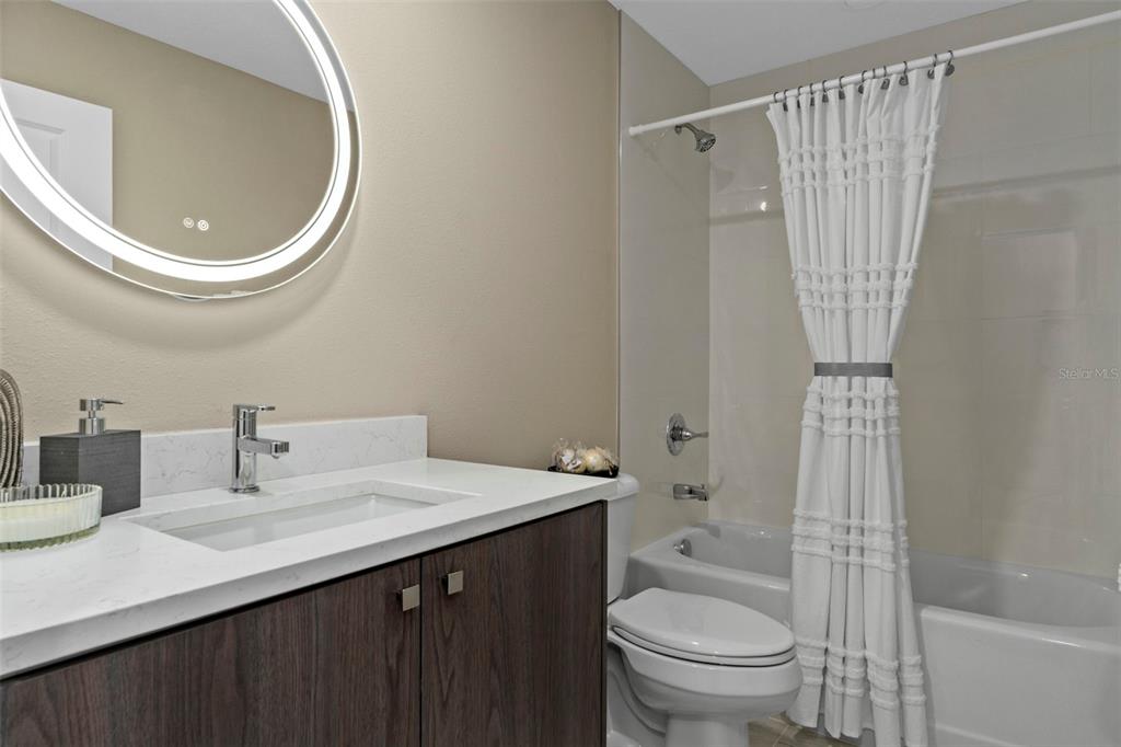 3011 East Griffin Street Inverness, FL 34453 - Photo 33 of 45 a bathroom with a sink a toilet and a mirror