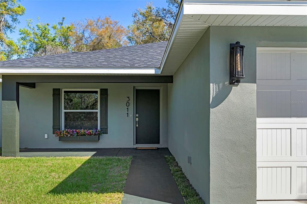 3011 East Griffin Street Inverness, FL 34453 - Photo 4 of 45 a front view of a house with garden