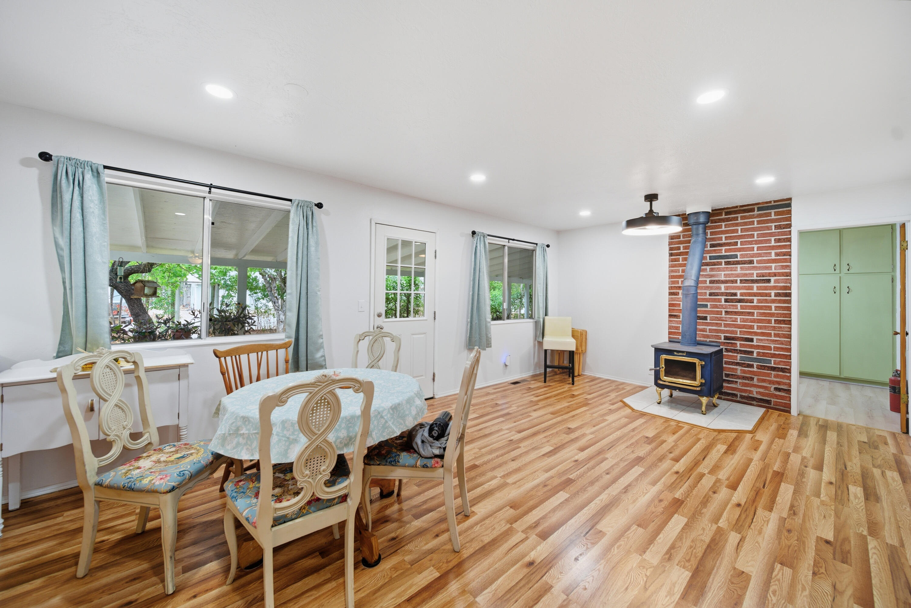 9807 Logan Road Palo Cedro, CA 96073 - Photo 11 of 53 a view of a dining room with furniture window and wooden floor