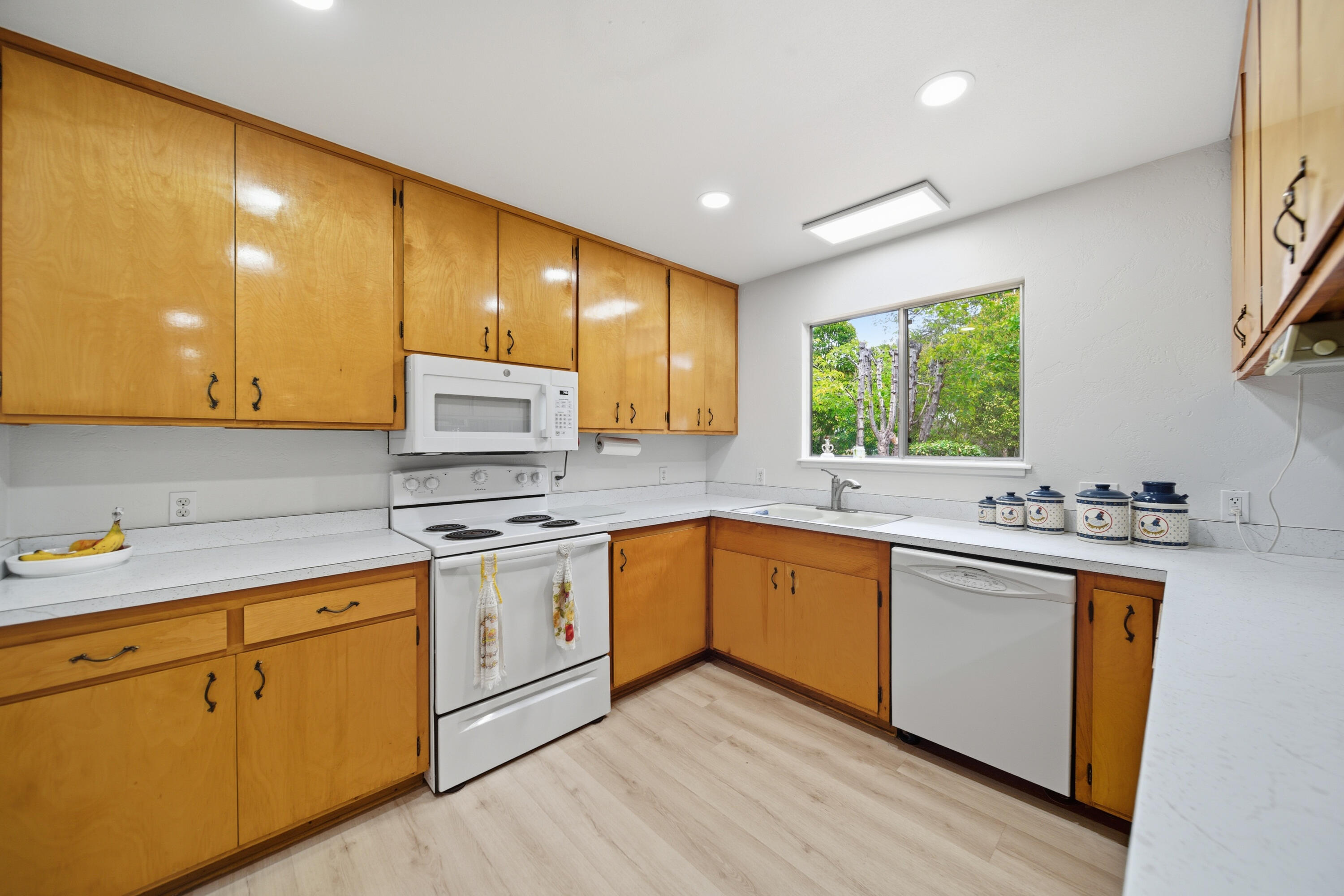 9807 Logan Road Palo Cedro, CA 96073 - Photo 15 of 53 a kitchen with stainless steel appliances granite countertop a sink stove and cabinets