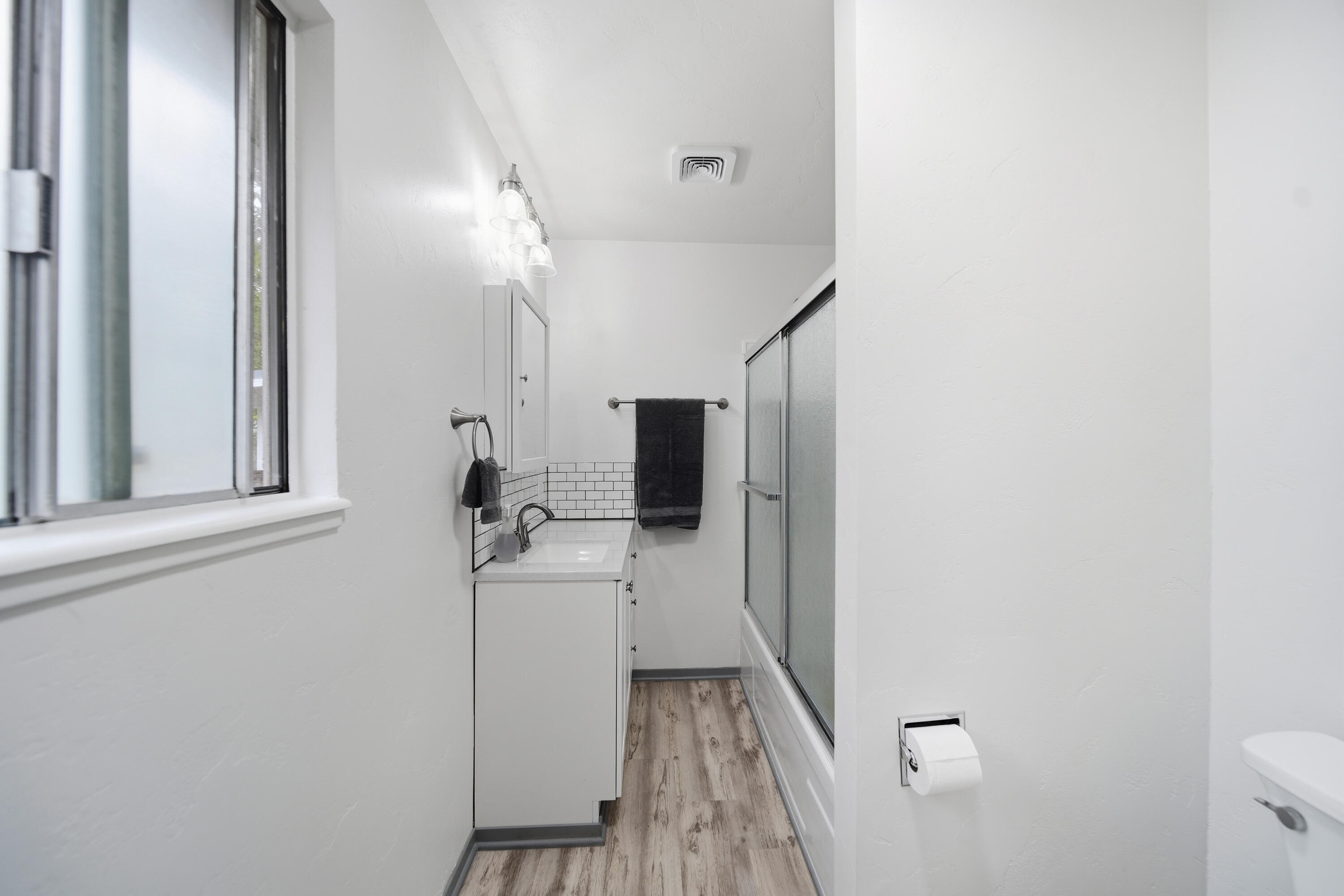 9807 Logan Road Palo Cedro, CA 96073 - Photo 23 of 53 a view of a hallway with a room and wooden floor