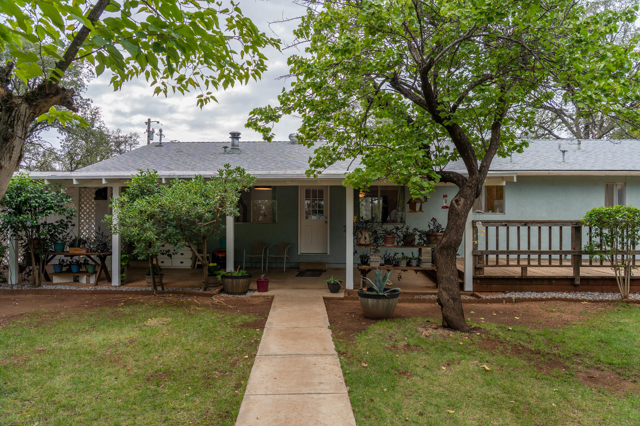 9807 Logan Road Palo Cedro, CA 96073 - Photo 28 of 53 a front view of a house with garden