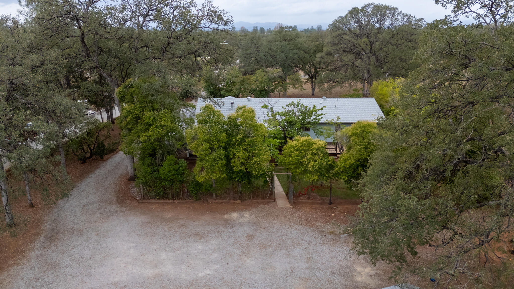 9807 Logan Road Palo Cedro, CA 96073 - Photo 31 of 53 an aerial view of a house with a yard