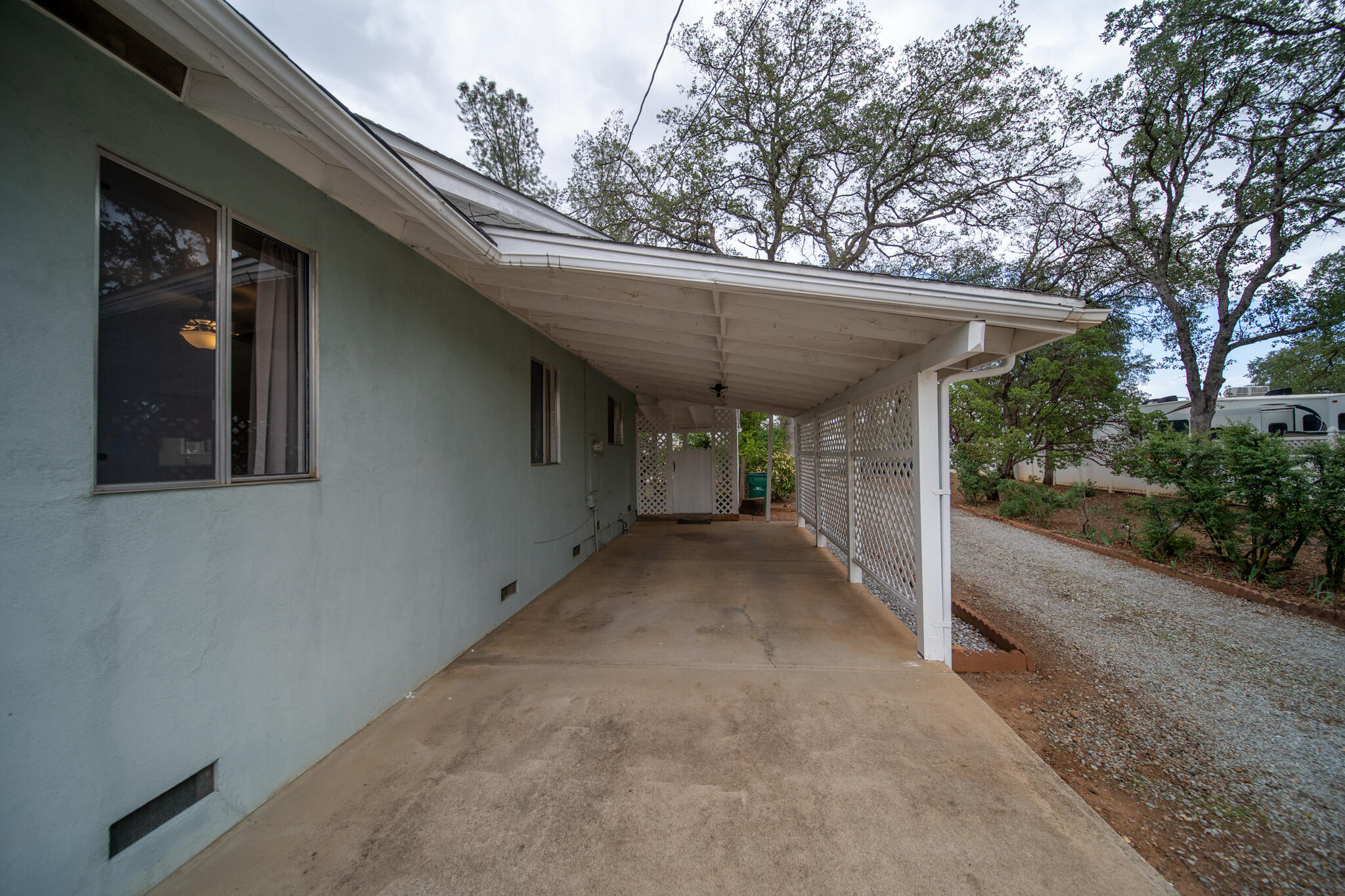 9807 Logan Road Palo Cedro, CA 96073 - Photo 40 of 53 a view of a house with a small yard and a large tree