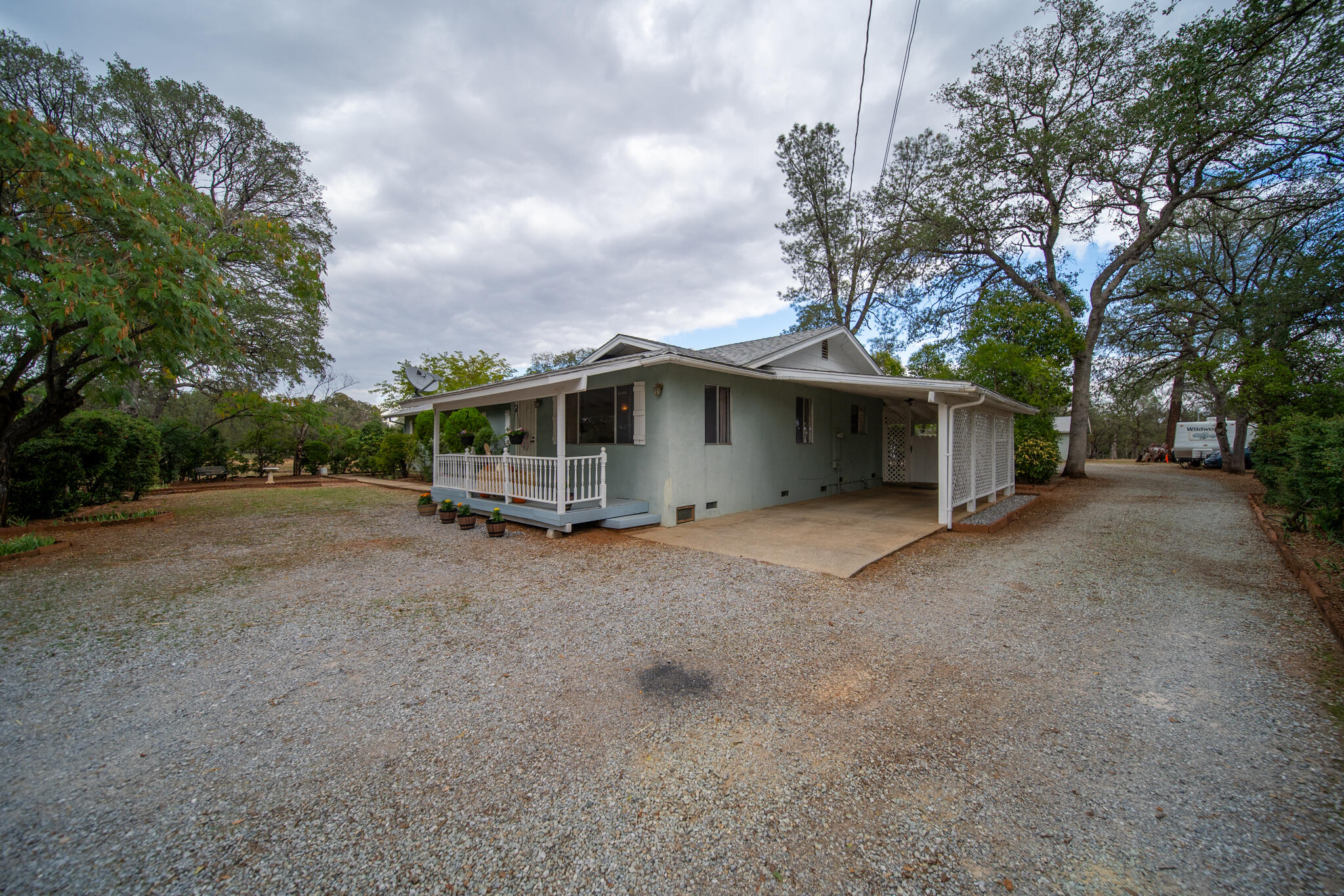 9807 Logan Road Palo Cedro, CA 96073 - Photo 41 of 53 a view of a house with a backyard
