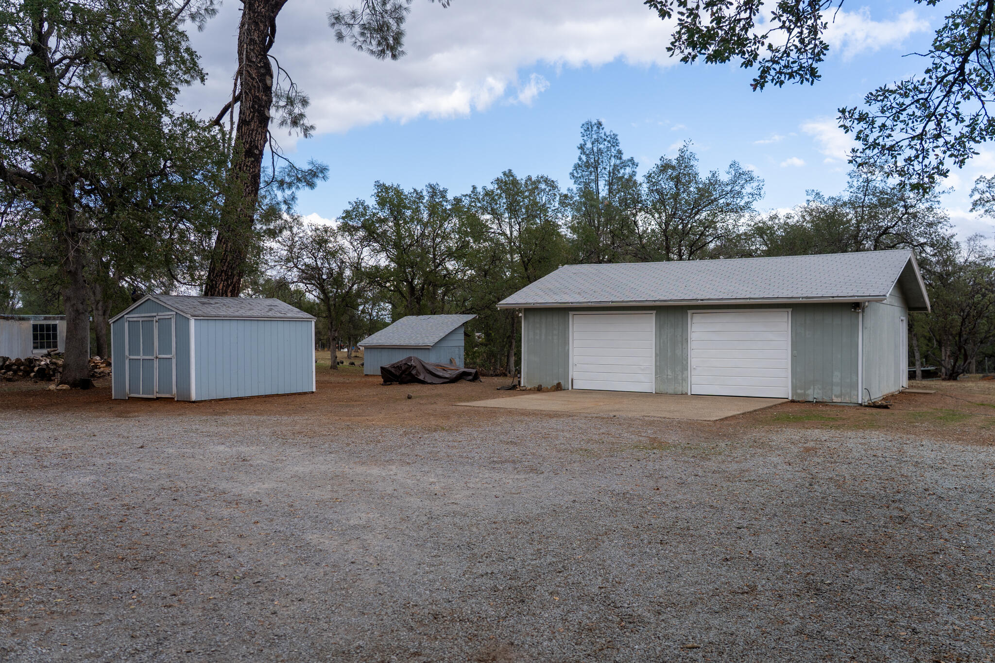 9807 Logan Road Palo Cedro, CA 96073 - Photo 46 of 53 a house with trees in the background