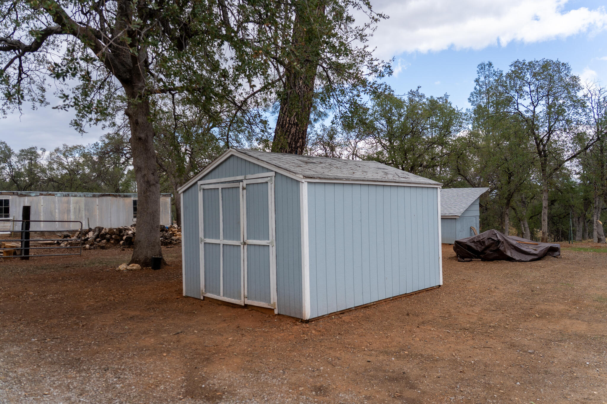 9807 Logan Road Palo Cedro, CA 96073 - Photo 47 of 53 a view of a house with a yard and covered with snow in the background