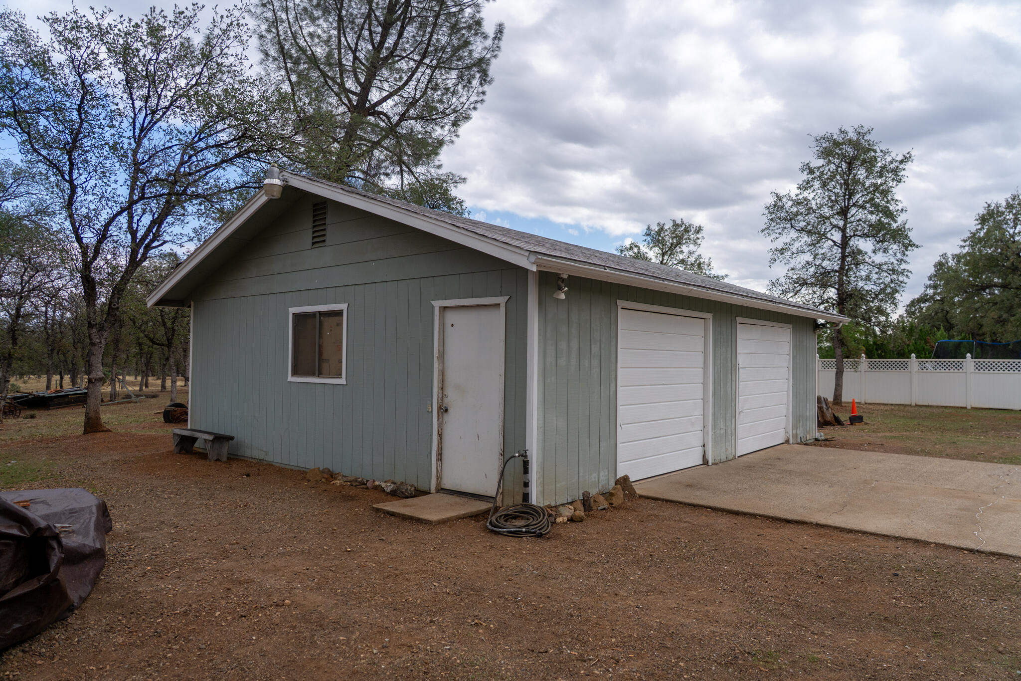 9807 Logan Road Palo Cedro, CA 96073 - Photo 48 of 53 a backyard of a house with garage