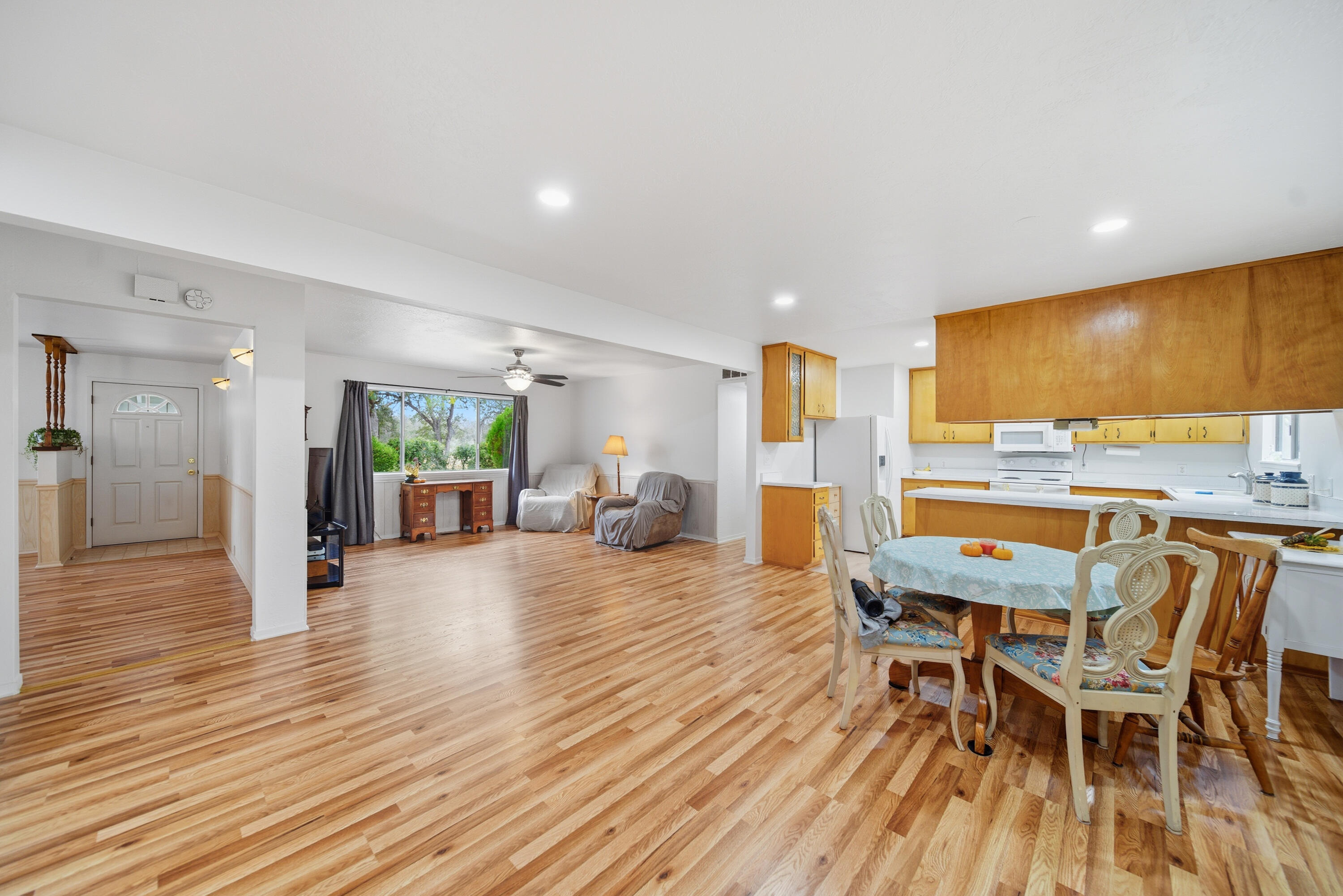 9807 Logan Road Palo Cedro, CA 96073 - Photo 6 of 53 a view of a dining room with furniture and wooden floor