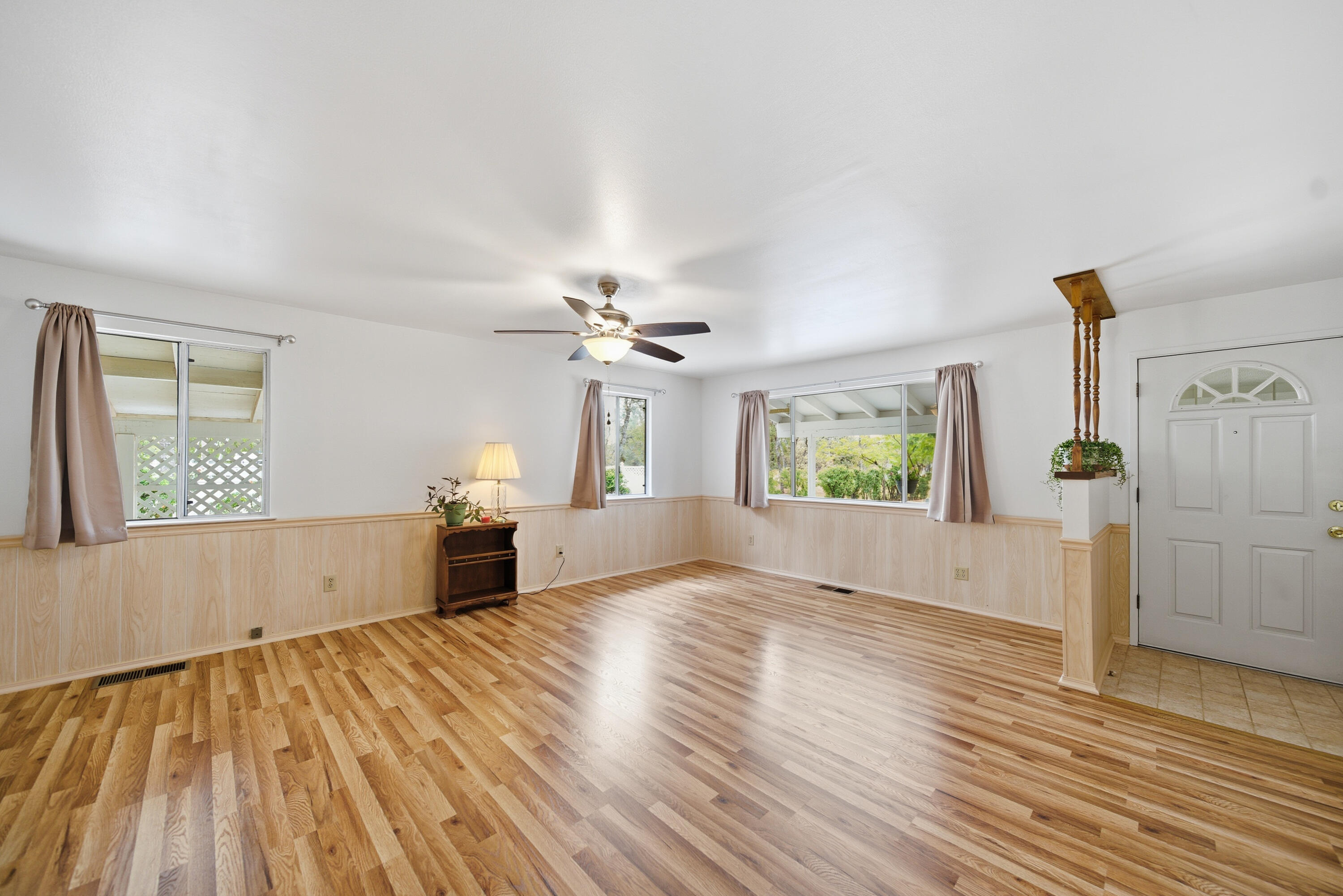 9807 Logan Road Palo Cedro, CA 96073 - Photo 10 of 53 a view of empty room with wooden floor and fan