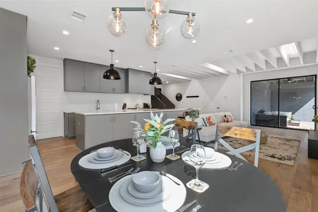 a kitchen with a table and chairs in it