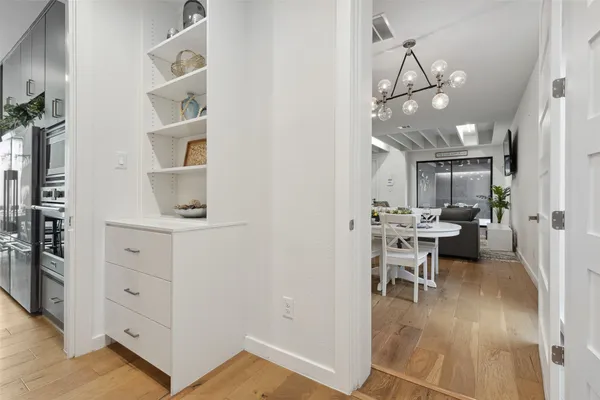 a view of a dining room with furniture and wooden floor