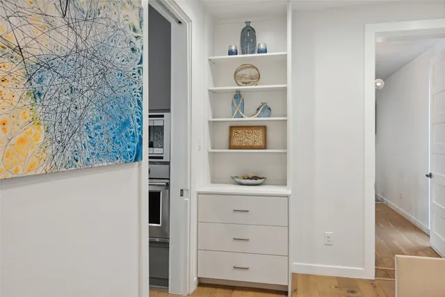 a view of cabinets and wooden floor