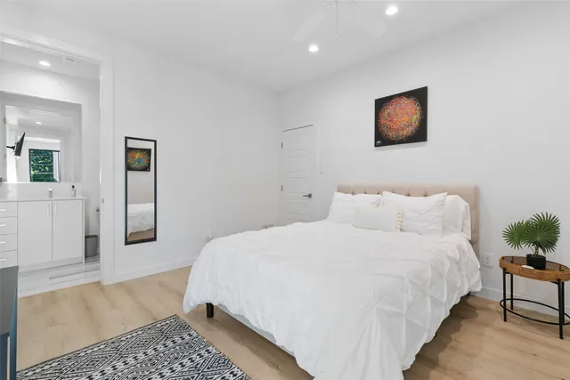 a bedroom with a bed and a couch