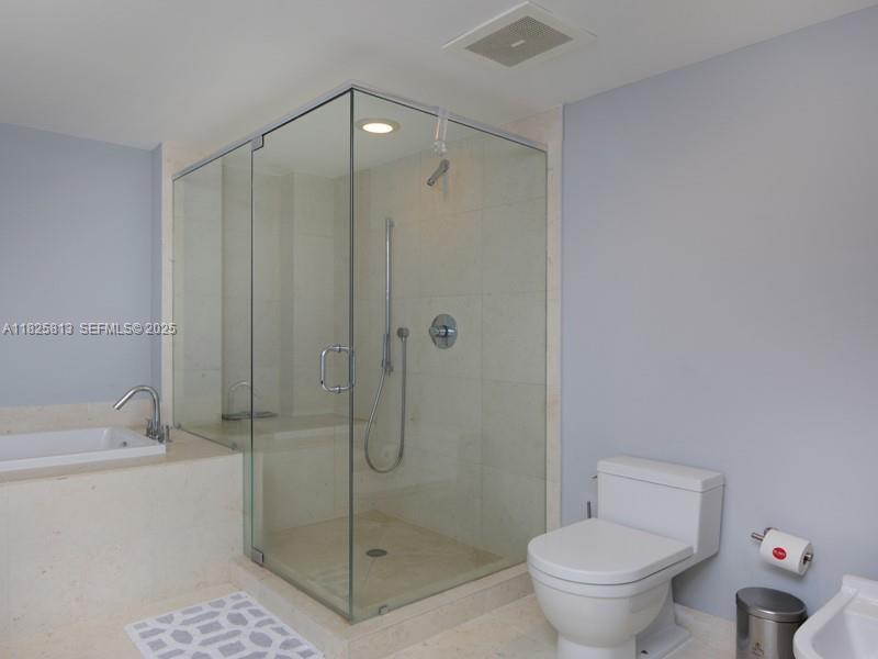 495 Brickell Avenue, Unit 4205 Miami, FL 33131 - Photo 13 of 21 a bathroom with a shower and a toilet