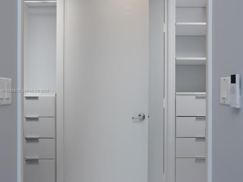 495 Brickell Avenue, Unit 4205 Miami, FL 33131 - Photo 14 of 21 a bathroom with a closet
