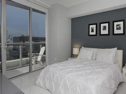 a room with closet and a flat screen tv