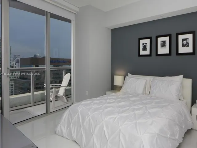 a room with closet and a flat screen tv