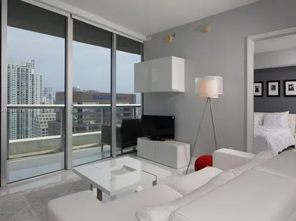 a kitchen with granite countertop a sink stainless steel appliances and cabinets