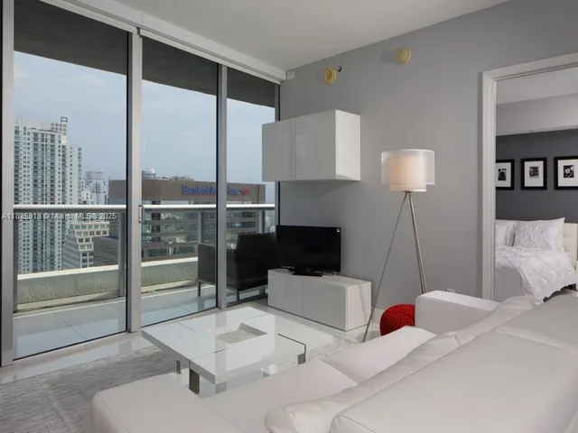 a kitchen with granite countertop a sink stainless steel appliances and cabinets