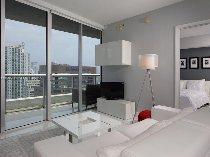 495 Brickell Avenue, Unit 4205 Miami, FL 33131 - Photo 4 of 21 a living room with furniture