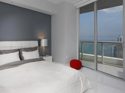 a bathroom with double sink and a mirror