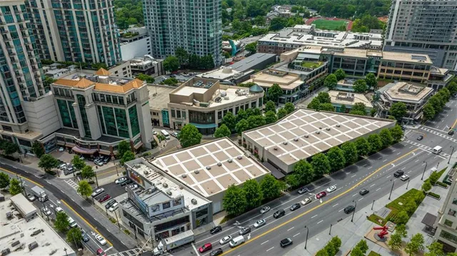 a view of multiple houses with yard