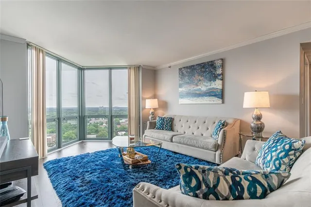 a living room with furniture and a rug