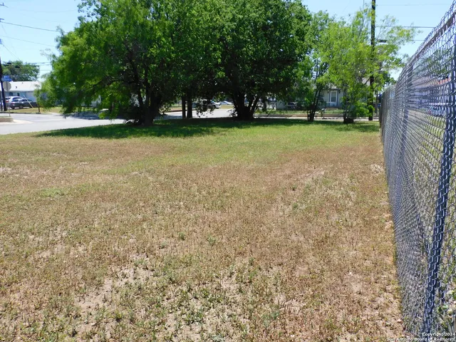 a view of a road with a yard