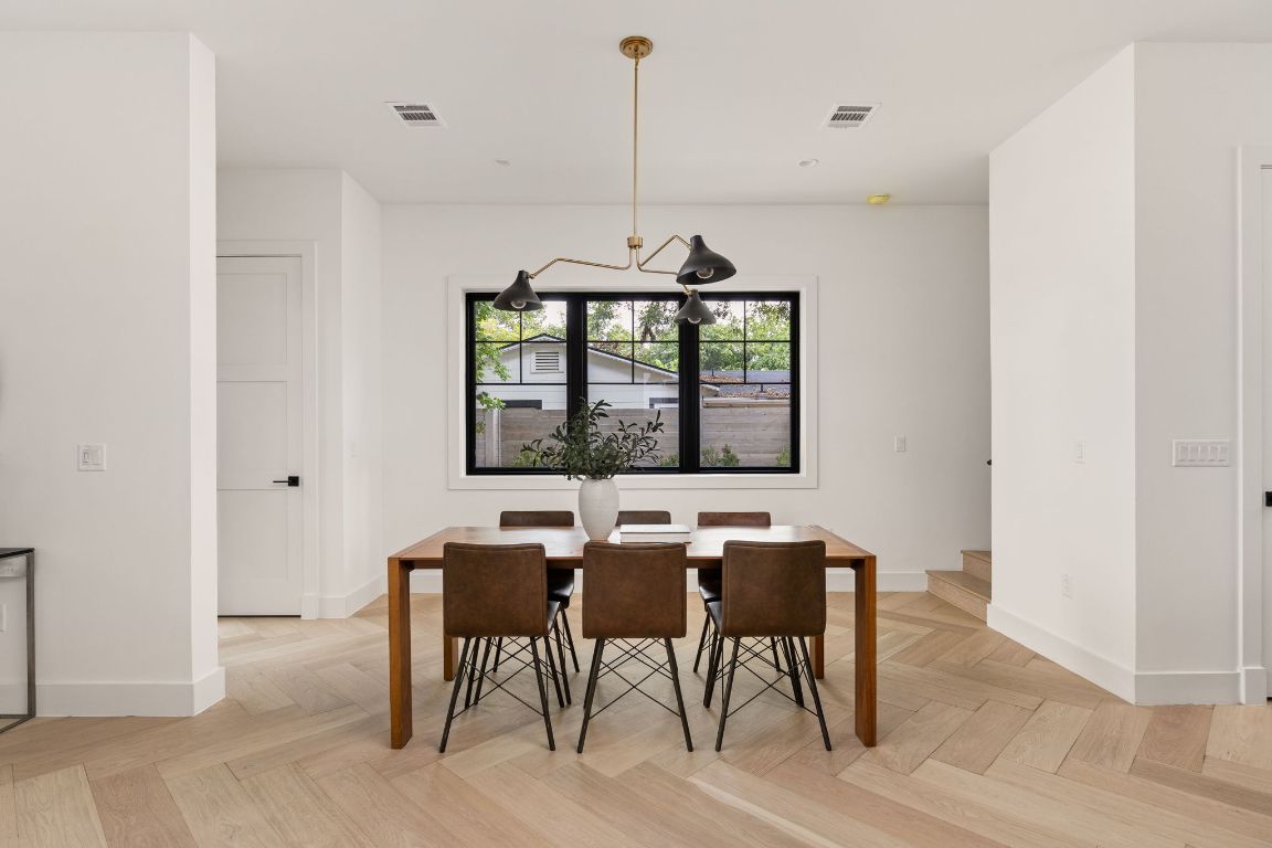 2707 Stacy Lane, Unit 1 Austin, TX 78704 - Photo 13 of 40 a view of a dining room with furniture window and outside view