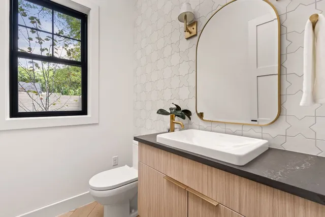 a close view of a sink and a kitchen counter space