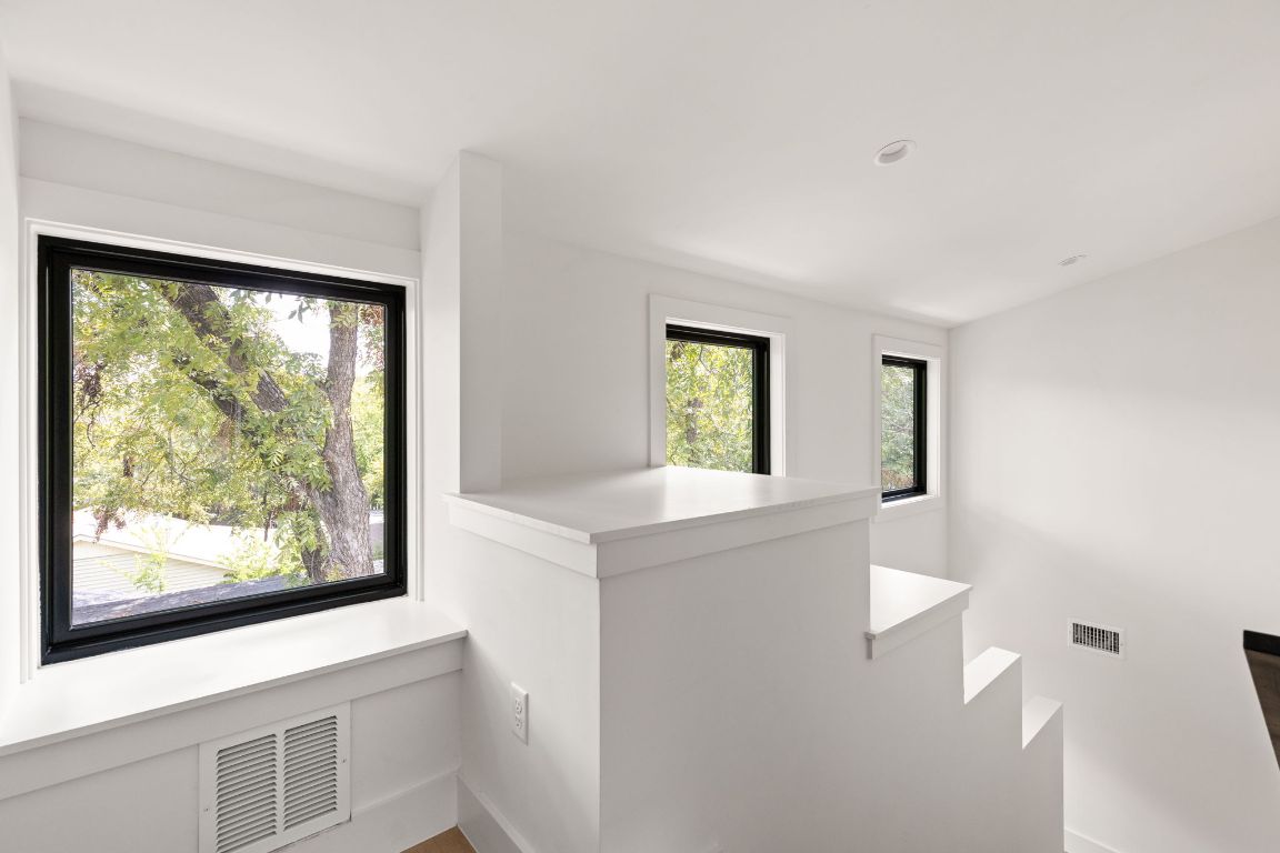 2707 Stacy Lane, Unit 1 Austin, TX 78704 - Photo 29 of 40 a view of kitchen with wooden floor and windows